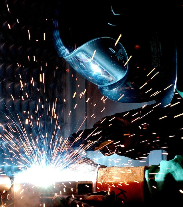 A welder working on a sheet-metal part. The labor shortage in sheet-metal manufacturing is a major challenge for the industry.